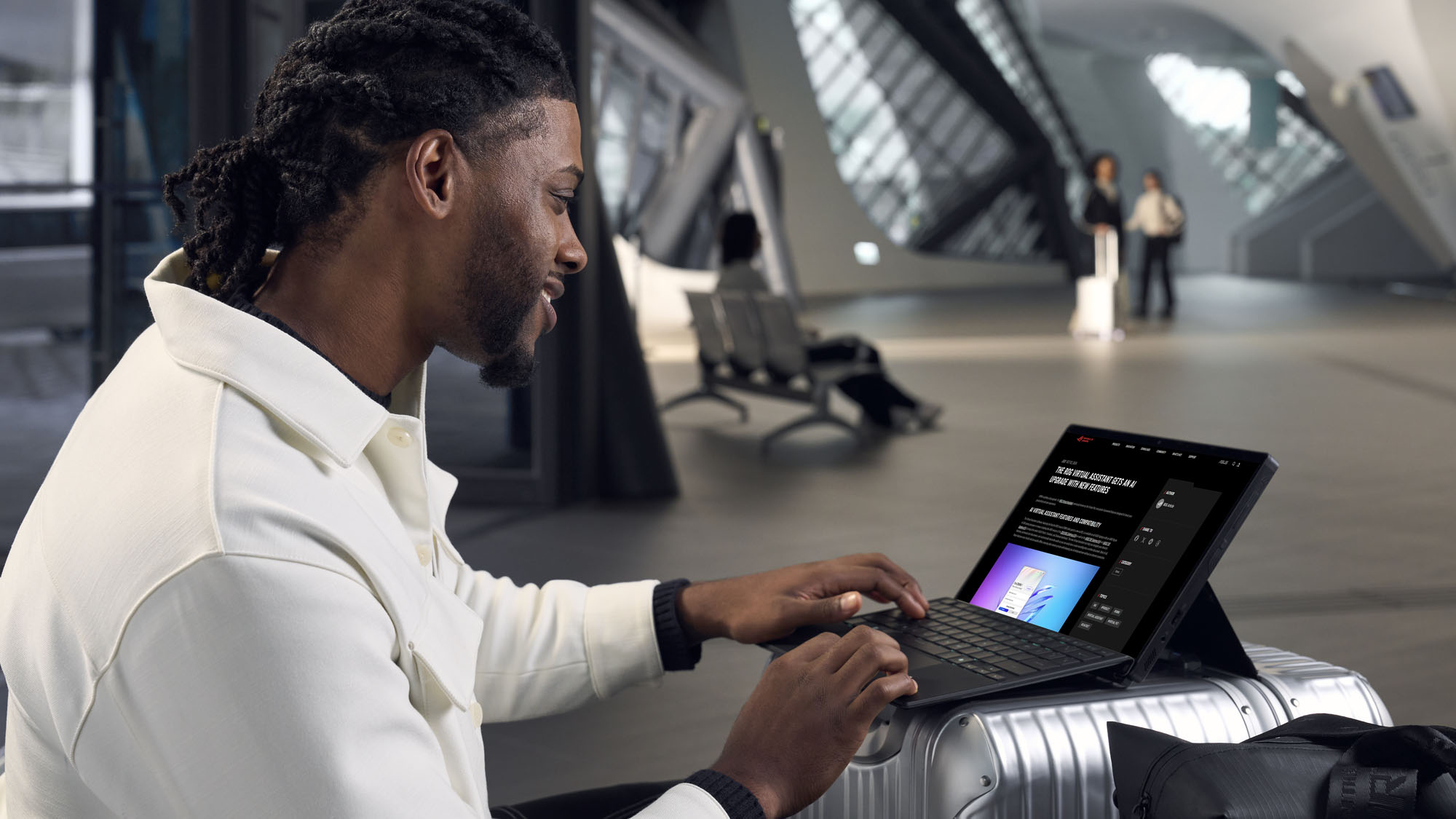 A man using the ROG Flow Z13 propped up on a piece of luggage.